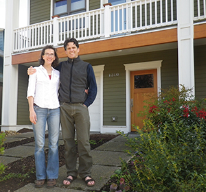 Crissy Trask and Chris Moore in front of their home